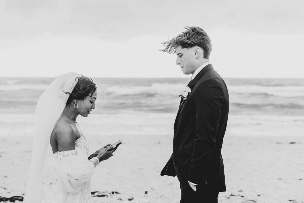 Bride and groom exchanging vows during Naples Florida beach elopement with ocean backdrop